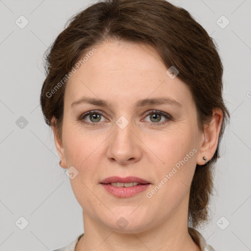 Joyful white adult female with medium  brown hair and grey eyes