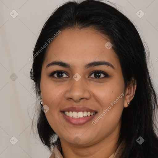 Joyful latino young-adult female with long  black hair and brown eyes