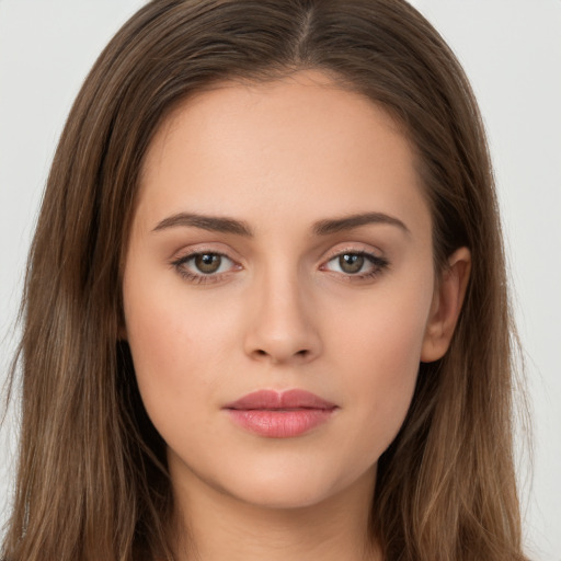 Neutral white young-adult female with long  brown hair and brown eyes