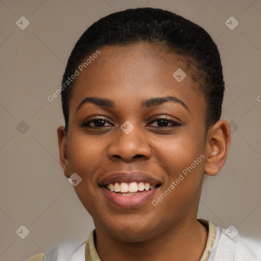 Joyful black young-adult female with short  black hair and brown eyes