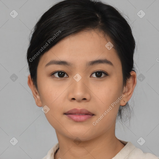 Joyful asian young-adult female with short  black hair and brown eyes