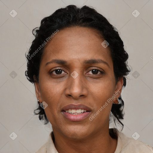 Joyful black adult female with short  brown hair and brown eyes