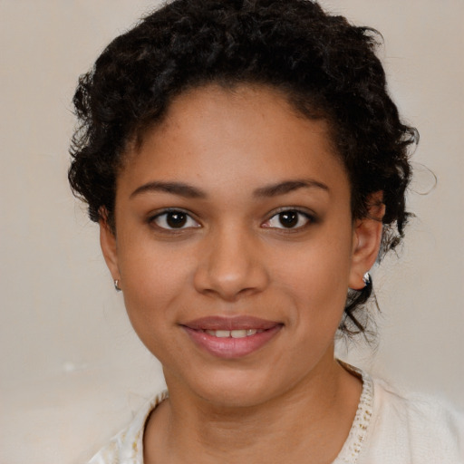Joyful latino young-adult female with short  brown hair and brown eyes