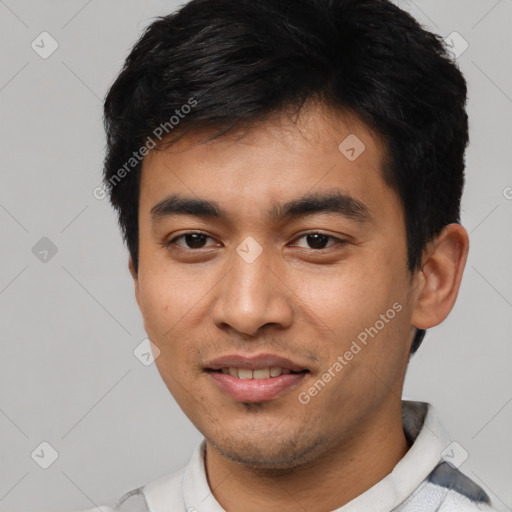 Joyful asian young-adult male with short  black hair and brown eyes