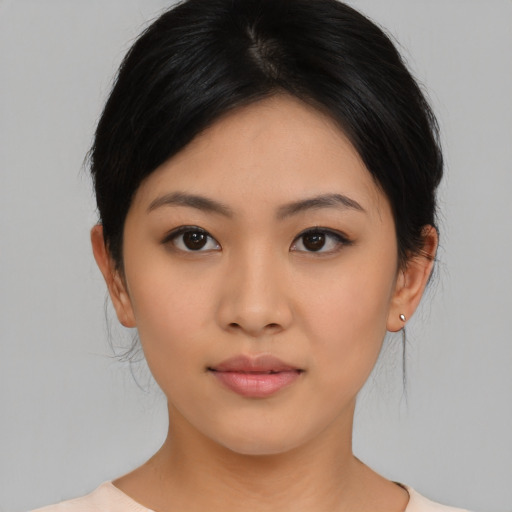 Neutral asian young-adult female with medium  black hair and brown eyes