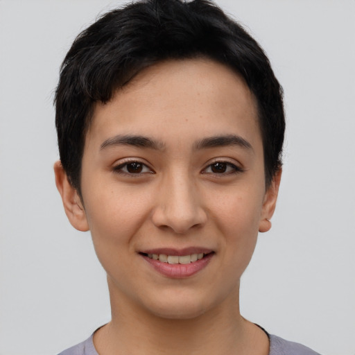 Joyful asian young-adult female with short  black hair and brown eyes