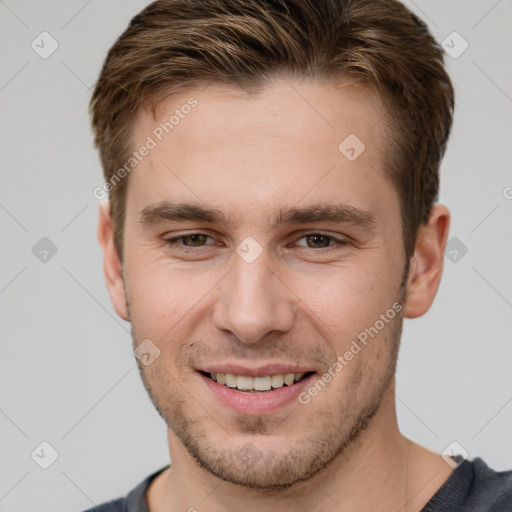 Joyful white young-adult male with short  brown hair and grey eyes