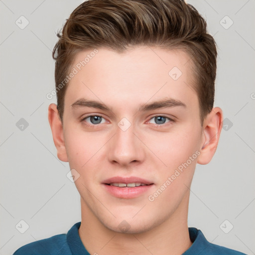 Joyful white young-adult male with short  brown hair and grey eyes