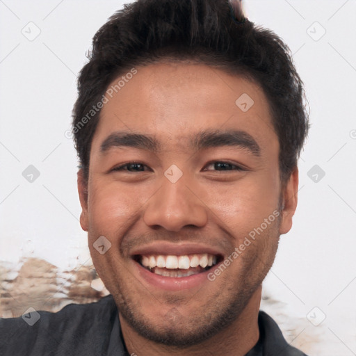 Joyful white young-adult male with short  black hair and brown eyes