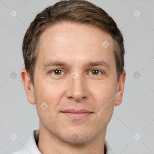 Joyful white adult male with short  brown hair and brown eyes