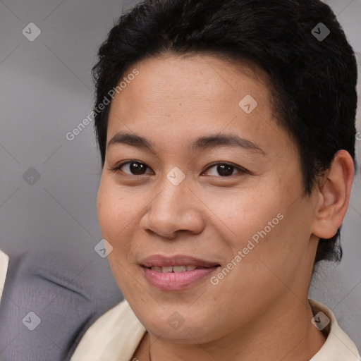 Joyful asian young-adult female with short  brown hair and brown eyes