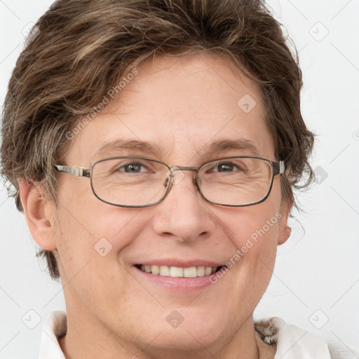 Joyful white adult female with short  brown hair and grey eyes