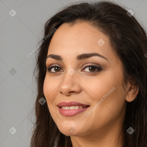 Joyful white young-adult female with long  brown hair and brown eyes