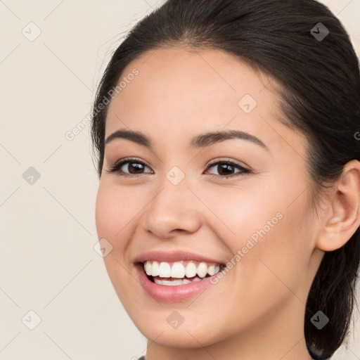 Joyful white young-adult female with long  brown hair and brown eyes