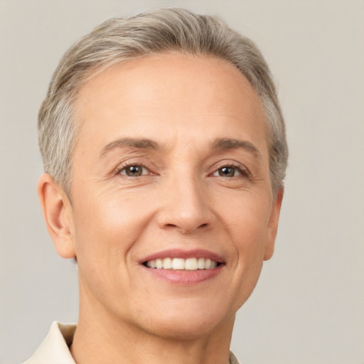 Joyful white adult female with short  brown hair and brown eyes