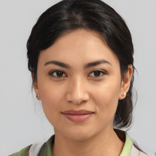 Joyful asian young-adult female with medium  brown hair and brown eyes