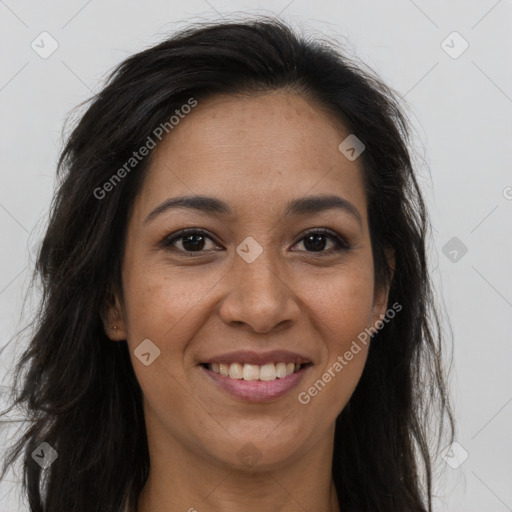 Joyful black young-adult female with long  brown hair and brown eyes