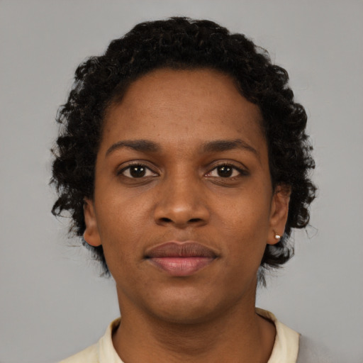 Neutral black young-adult female with short  brown hair and brown eyes