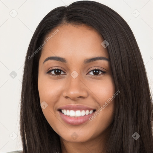 Joyful latino young-adult female with long  black hair and brown eyes