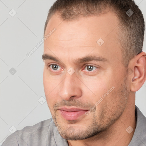 Joyful white adult male with short  brown hair and brown eyes