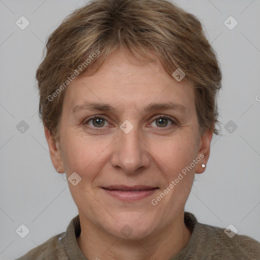 Joyful white adult female with short  brown hair and grey eyes