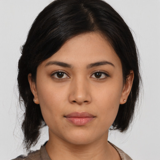 Neutral asian young-adult female with medium  brown hair and brown eyes