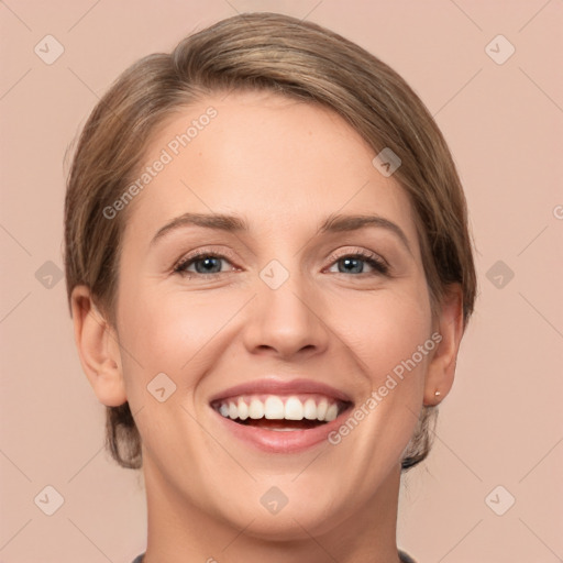 Joyful white young-adult female with short  brown hair and grey eyes