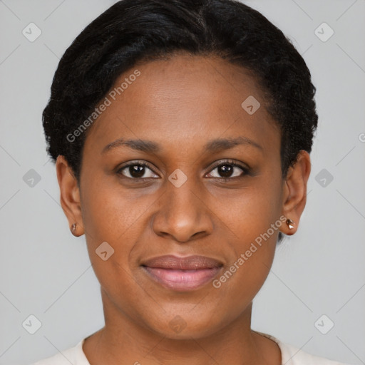 Joyful black young-adult female with short  brown hair and brown eyes