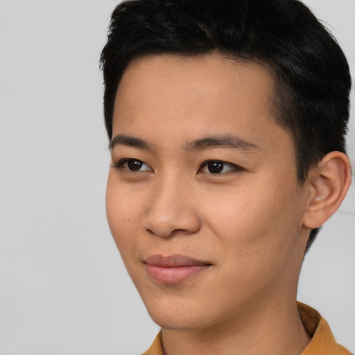 Joyful asian young-adult female with short  black hair and brown eyes