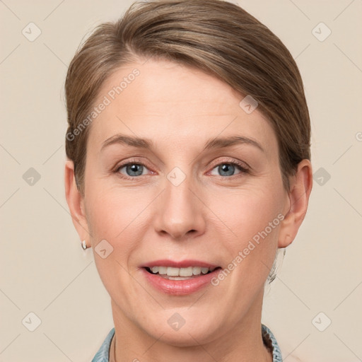 Joyful white adult female with short  brown hair and grey eyes