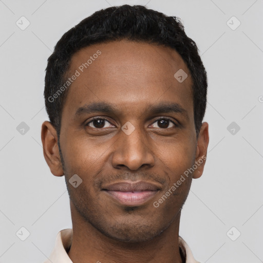 Joyful black young-adult male with short  black hair and brown eyes