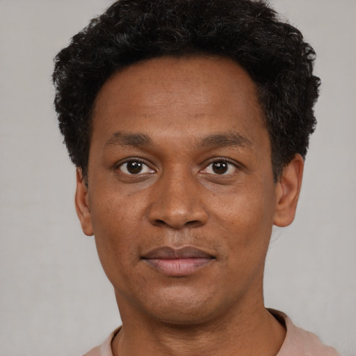 Neutral black adult male with short  black hair and brown eyes