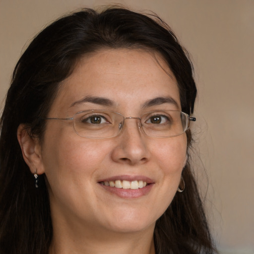 Joyful white adult female with long  brown hair and brown eyes