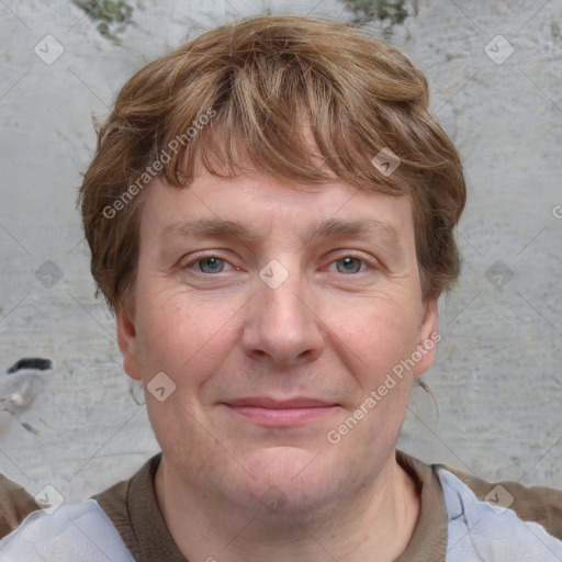 Joyful white adult male with short  brown hair and blue eyes