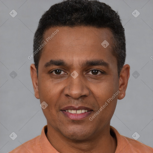 Joyful white young-adult male with short  black hair and brown eyes