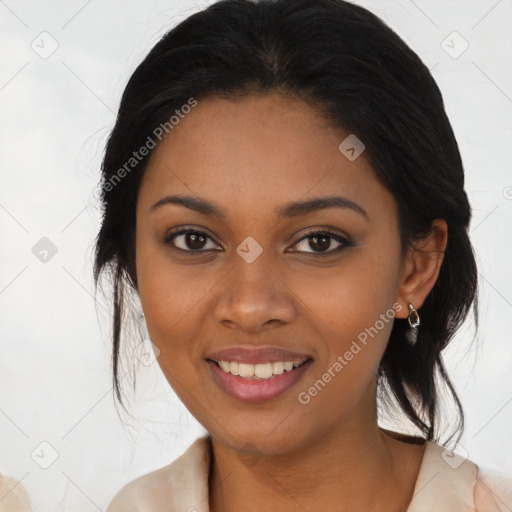 Joyful black young-adult female with medium  black hair and brown eyes