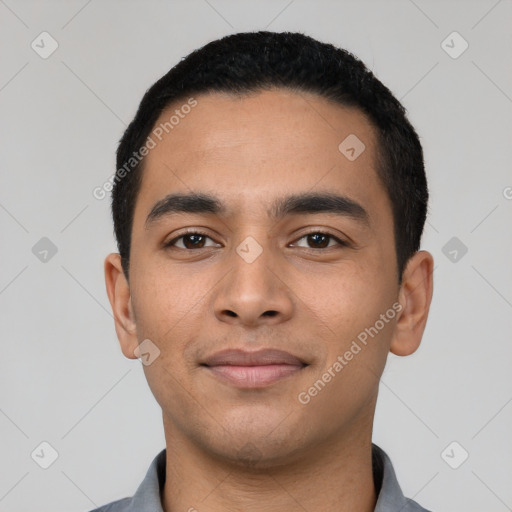 Joyful latino young-adult male with short  black hair and brown eyes