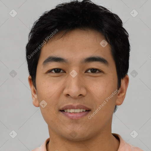 Joyful asian young-adult male with short  black hair and brown eyes