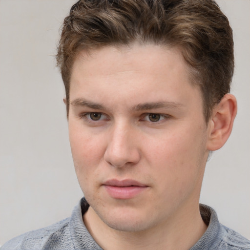 Neutral white young-adult male with short  brown hair and grey eyes