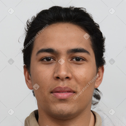 Neutral latino young-adult male with short  brown hair and brown eyes