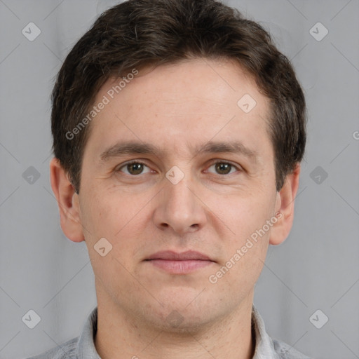 Joyful white adult male with short  brown hair and grey eyes