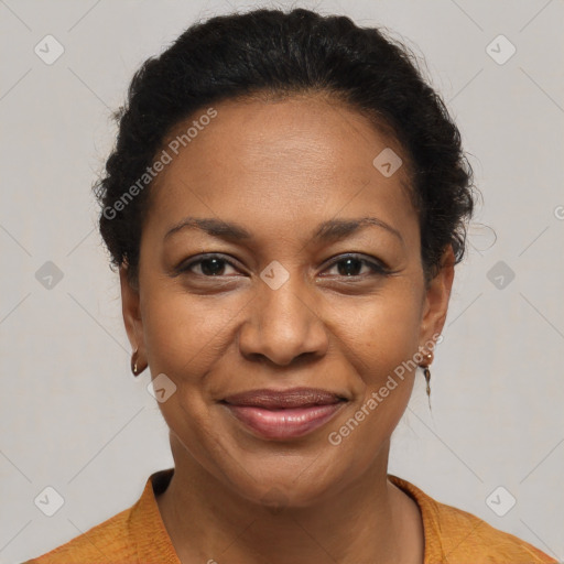 Joyful black adult female with short  brown hair and brown eyes