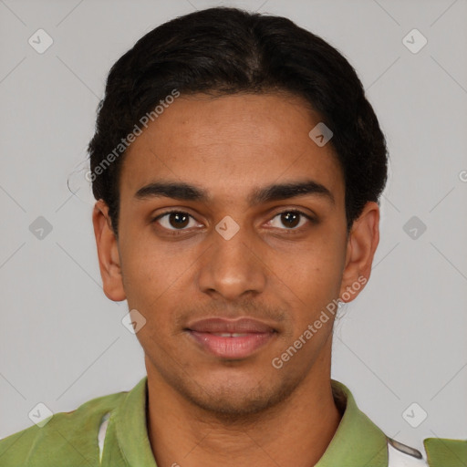 Joyful latino young-adult male with short  black hair and brown eyes