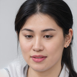 Joyful asian young-adult female with medium  brown hair and brown eyes