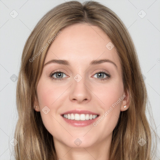 Joyful white young-adult female with long  brown hair and grey eyes