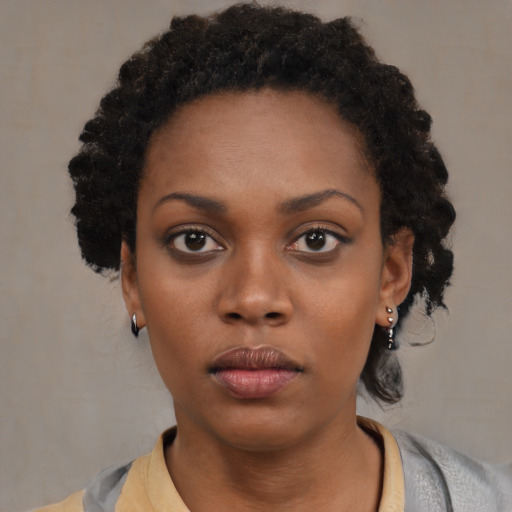 Neutral black young-adult female with short  black hair and brown eyes