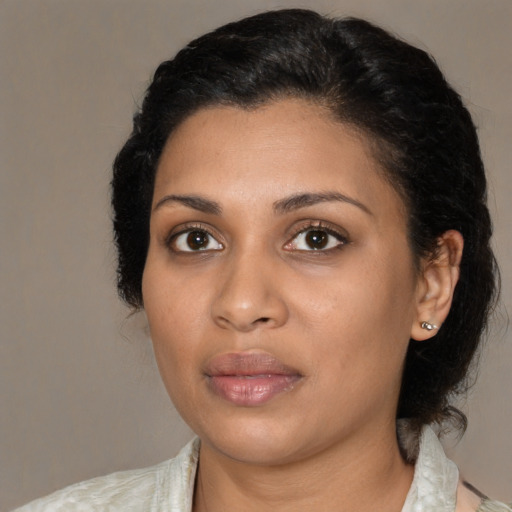 Neutral black young-adult female with medium  black hair and brown eyes