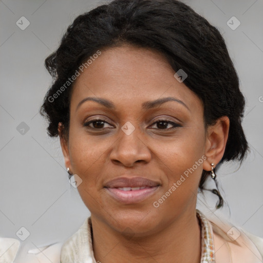 Joyful black adult female with medium  brown hair and brown eyes