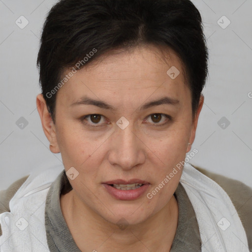 Joyful white adult female with short  brown hair and brown eyes