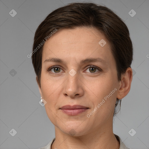 Joyful white adult female with short  brown hair and grey eyes